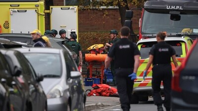 Emergency personnel work at the scene, after a reported attack in which a car was driven at pedestrians and one person was stabbed near a synagogue in north Manchester, Britain (REUTERS)