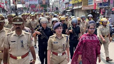 Bareilly SP South Anshika Verma leads a flag march in a sensitive area of the district on Thursday. (ANI Grab) Bareilly SP South Anshika Verma leads a flag march in a sensitive area of the district on Thursday. (ANI Grab)