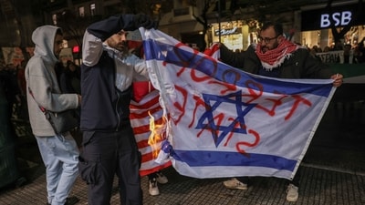 Pro-Palestinian demonstrators burn a defaced Israeli flag as they protest after Israel intercepted some of the vessels of the Global Sumud Flotilla aiming to reach Gaza and break Israel's naval blockade, in Thessaloniki, Greece, October 2, 2025. (REUTERS)