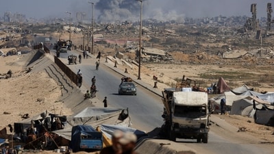 Smoke rises during an Israeli military operation as displaced Palestinians flee Gaza City, in the central Gaza Strip, on September 30, 2025. (Dawoud Abu Alkas/Reuters)