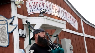 Joey Whitaker from Holden Beach plays "Amazing Grace" on the bagpipes in front of the American Fish Company following a fatal shooting that occurred here on Sunday, Sept. 28. (AP) Joey Whitaker from Holden Beach plays "Amazing Grace" on the bagpipes in front of the American Fish Company following a fatal shooting that occurred here on Sunday, Sept. 28. (AP)