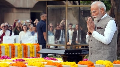 Prime Minister Narendra Modi pays homage to Mahatma Gandhi on his birth anniversary at Rajghat in New Delhi. (PTI) Prime Minister Narendra Modi pays homage to Mahatma Gandhi on his birth anniversary at Rajghat in New Delhi. (PTI)