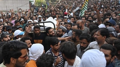 Awami Action Committee (AAC) activists gather around the coffin of a protester who was allegedly killed by police personnel, during a demonstration in Muzaffarabad, capital of Pakistan-occupied Kashmir (AFP)
