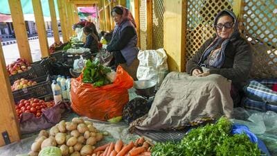 Women selling vegetables at a market amid relaxation in curfew in Leh on Thursday. (PTI Photo) Women selling vegetables at a market amid relaxation in curfew in Leh on Thursday. (PTI Photo)
