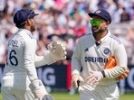 India's Dhruv Jurel, left, greets Rishabh Pant as the former arrives on the field during a match.
