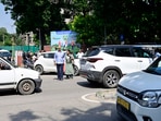 Patients try to cross the dividing road between Sector 11-12 near PGI Gate No 2 in Chandigarh. (Ravi Kumar/HT)