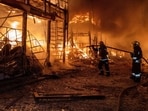 Firefighters tackle the blaze after a Russian air attack in Kharkiv. Firefighters tackle the blaze after a Russian air attack in Kharkiv.