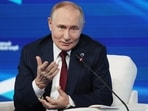 Russian President Vladimir Putin gestures as he answers questions during a meeting with foreign policy experts at the Valdai Discussion Club in the Black Sea resort of Sochi on Thursday, 