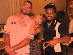 Taylor Swift and Travis Kelce posed with a fan at his restaurant.