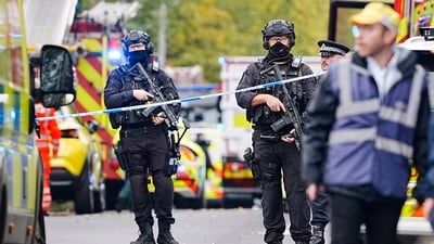 Armed police officers at the scene of a stabbing incident at Heaton Park Hebrew Congregation synagogue, in Crumpsall, Manchester, England, (AP) Armed police officers at the scene of a stabbing incident at Heaton Park Hebrew Congregation synagogue, in Crumpsall, Manchester, England, (AP)