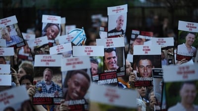 People hold up posters of hostages in Hamas captivity in Gaza, to demand their release, in Buenos Aires, Argentina, Tuesday, Sept. 30, 2025. (AP)