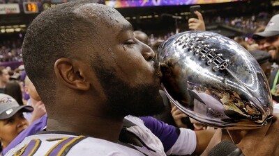 Baltimore Ravens defensive end Arthur Jones (97) kisses the Vince Lombardi Trophy after defeating the San Francisco 49ers (AP) Baltimore Ravens defensive end Arthur Jones (97) kisses the Vince Lombardi Trophy after defeating the San Francisco 49ers (AP)