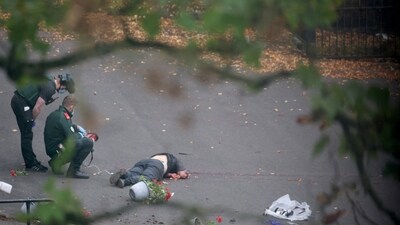 Ambulance incident workers process the body of a man, believed to be the attacker, at the scene, after a report of an incident in which a car was driven at pedestrians and a stabbing attack outside a synagogue, in north Manchester, Britain. REUTERS/Hannah McKay (REUTERS)