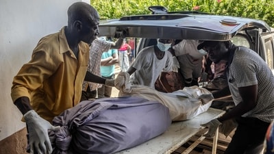 Almost 450 bodies were discovered in mass graves -- most starved to death, though some, including children, were strangled, beaten and suffocated. (Luis Tato/AFP) Almost 450 bodies were discovered in mass graves -- most starved to death, though some, including children, were strangled, beaten and suffocated. (Luis Tato/AFP)