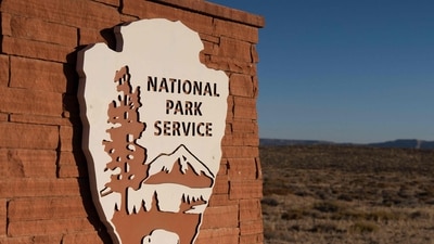 The U.S. National Parks Service logo is displayed at Glen Canyon National Recreation Area on July 10, 2025 in Page, Arizona. (Getty Images via AFP)