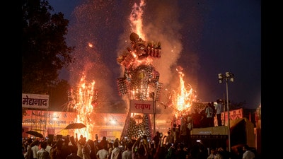 Organisers scrambled with wet effigies, wiring checks and waterlogging fixes, but spectators cheered as towering effigies burned bright across city. (RAJ K RAJ /HT PHOTO) Organisers scrambled with wet effigies, wiring checks and waterlogging fixes, but spectators cheered as towering effigies burned bright across city. (RAJ K RAJ /HT PHOTO)