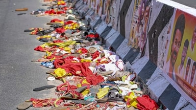 Footwear and other belongings of people lie on a road in the aftermath of stampede during a rally of actor and Tamilaga Vetri Kazhagam (TVK) chief Vijay, in Karur district, Tamil Nadu. (PTI File) Footwear and other belongings of people lie on a road in the aftermath of stampede during a rally of actor and Tamilaga Vetri Kazhagam (TVK) chief Vijay, in Karur district, Tamil Nadu. (PTI File)