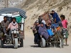 Displaced Palestinians fleeing northern Gaza due to an Israeli military operation.