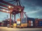 Logistics and transportation of Container Cargo ship and Cargo plane with working crane bridge in shipyard at sunrise, logistic import export and transport industry background.