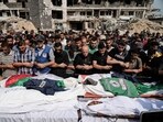 Palestinians pray over the bodies of journalists who were killed in an Israeli airstrike in Aug Palestinians pray over the bodies of journalists who were killed in an Israeli airstrike in Aug