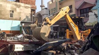 A bulldozer in action in Bareilly on Saturday. (ANI PHOTO) A bulldozer in action in Bareilly on Saturday. (ANI PHOTO)