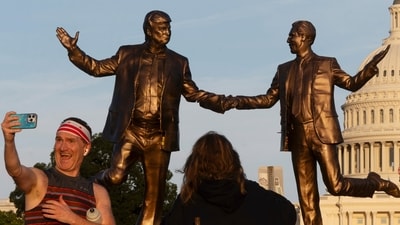 A statue depicting President Donald Trump and Jeffrey Epstein holding hands is back on display in front of US Capitol, (AP) A statue depicting President Donald Trump and Jeffrey Epstein holding hands is back on display in front of US Capitol, (AP)