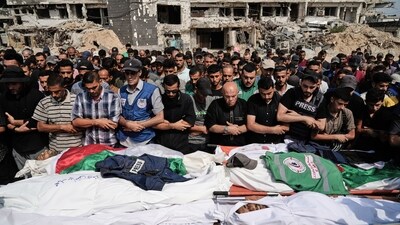 Palestinians pray over the bodies of journalists who were killed in an Israeli airstrike in Aug (AP/File) Palestinians pray over the bodies of journalists who were killed in an Israeli airstrike in Aug (AP/File)