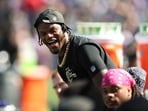 Lamar Jackson #8 of the Baltimore Ravens looks on from the sideline during the second quarter against the Houston Texans 