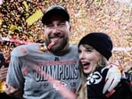 FILE - Travis Kelce, left, and Taylor Swift pose after the AFC Championship NFL football game against the Buffalo Bills, Jan. 26, 2025, in Kansas City, Mo. (AP Photo/Ashley Landis, File) FILE - Travis Kelce, left, and Taylor Swift pose after the AFC Championship NFL football game against the Buffalo Bills, Jan. 26, 2025, in Kansas City, Mo. (AP Photo/Ashley Landis, File)