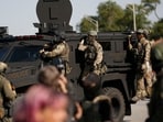 Federal law enforcement agents arrive on an armored tactical vehicle as hundreds of protesters gather near an Immigration and Customs Enforcement (ICE) facility opposing the detention of undocumented immigrants following President Donald Trump'ss order to increase federal presence and step up immigration enforcement through the Department of Homeland Security in Broadview, Illinois (Photo by OCTAVIO JONES / AFP) Federal law enforcement agents arrive on an armored tactical vehicle as hundreds of protesters gather near an Immigration and Customs Enforcement (ICE) facility opposing the detention of undocumented immigrants following President Donald Trump'ss order to increase federal presence and step up immigration enforcement through the Department of Homeland Security in Broadview, Illinois (Photo by OCTAVIO JONES / AFP)