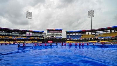 Groundmen cover the pitch as rain delays the start of the 2025 ICC Women's Cricket WC ODI match between Sri Lanka and Australia (AFP) Groundmen cover the pitch as rain delays the start of the 2025 ICC Women's Cricket WC ODI match between Sri Lanka and Australia (AFP)