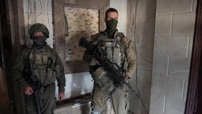 Israeli army soldiers inside a building in the vicinity of the Jordanian Field Hospital in Gaza City. (AFP) Israeli army soldiers inside a building in the vicinity of the Jordanian Field Hospital in Gaza City. (AFP)