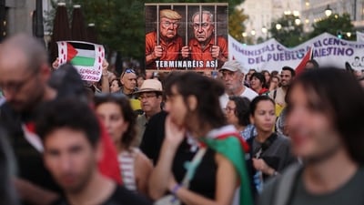 Protesters hold a placard depicting Donald Trump and Benjamin Netanyahu in prison, which reads "You will end up this way" during a demonstration in solidarity with the Palestinians in the Gaza Strip, in Madrid. (Thomas COEX / AFP) Protesters hold a placard depicting Donald Trump and Benjamin Netanyahu in prison, which reads "You will end up this way" during a demonstration in solidarity with the Palestinians in the Gaza Strip, in Madrid. (Thomas COEX / AFP)
