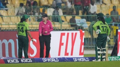 Pakistan's captain Fatima Sana, left, speaks to umpire about the dismissal of Muneeba Ali, right. (AP) Pakistan's captain Fatima Sana, left, speaks to umpire about the dismissal of Muneeba Ali, right. (AP)