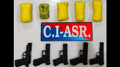 The Counter Intelligence (CI), Amritsar, has busted a cross-border arms and narcotics smuggling module with links to Pakistan with the arrest of two of its operatives and recovered 2.5 kg heroin and five sophisticated pistols from their possession, said director general of police (DGP), Punjab, Gaurav Yadav, here on Sunday. (HT Photo) The Counter Intelligence (CI), Amritsar, has busted a cross-border arms and narcotics smuggling module with links to Pakistan with the arrest of two of its operatives and recovered 2.5 kg heroin and five sophisticated pistols from their possession, said director general of police (DGP), Punjab, Gaurav Yadav, here on Sunday. (HT Photo)