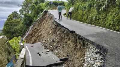 The Rohini road, connecting Siliguri and Darjeeling, was severely damaged after heavy rainfall triggered landslides in the region on Sunday. (PTI) The Rohini road, connecting Siliguri and Darjeeling, was severely damaged after heavy rainfall triggered landslides in the region on Sunday. (PTI)