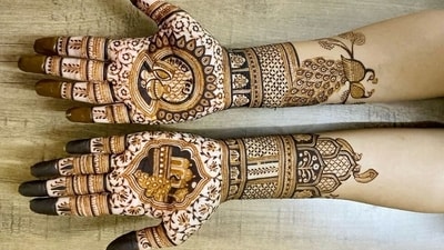 This stunning mehendi design features elegant peacocks, intricate latticework, and flowing leafy tendrils. The peacock motifs symbolise beauty and love, while the lattice and tendrils add depth and a festive charm to the design. (Pinterest) This stunning mehendi design features elegant peacocks, intricate latticework, and flowing leafy tendrils. The peacock motifs symbolise beauty and love, while the lattice and tendrils add depth and a festive charm to the design. (Pinterest)