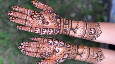 From traditional motifs to modern geometric patterns, mehendi adds a festive charm to every bride’s or wife’s ensemble. No Karwa Chauth look is complete without beautifully decorated hands, making it a timeless part of the festival. (Pinterest) From traditional motifs to modern geometric patterns, mehendi adds a festive charm to every bride’s or wife’s ensemble. No Karwa Chauth look is complete without beautifully decorated hands, making it a timeless part of the festival. (Pinterest)