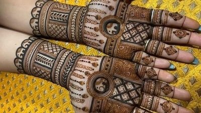 Women begin the day with a pre-dawn meal called ‘Sargi,’ prepared by their mother-in-law, to sustain them through the day-long fast. This mehendi design incorporates leafy tendrils and elephant motifs that symbolise growth, prosperity, and marital harmony. (instagram/@3d_henna_touch) Women begin the day with a pre-dawn meal called ‘Sargi,’ prepared by their mother-in-law, to sustain them through the day-long fast. This mehendi design incorporates leafy tendrils and elephant motifs that symbolise growth, prosperity, and marital harmony. (instagram/@3d_henna_touch)