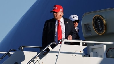 US President Donald Trump and first lady Melania Trump board Air Force One (REUTERS)