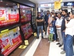 Patna: People watch the live telecast of Election Commission's press conference regarding the 2025 Bihar Assembly elections, at a showroom in Patna. (Photo by Santosh Kumar/ Hindustan Times)