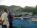 Darjeeling: Locals look at the damaged Dudhia iron bridge after landslides and heavy rainfall, in Darjeeling district, West Bengal, Monday, Oct. 6, 2025. (PTI Photo)(PTI10_06_2025_000297A) Darjeeling: Locals look at the damaged Dudhia iron bridge after landslides and heavy rainfall, in Darjeeling district, West Bengal, Monday, Oct. 6, 2025. (PTI Photo)(PTI10_06_2025_000297A)