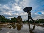 Tourists seen during light rains at Lodhi Garden in Delhi on Monday