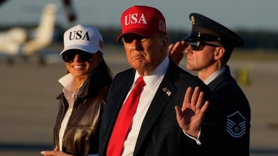 President Donald Trump arrives on Air Force One, with first lady Melania Trump Sunday, at Joint Base Andrews, Md. (AP) President Donald Trump arrives on Air Force One, with first lady Melania Trump Sunday, at Joint Base Andrews, Md. (AP)