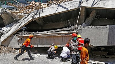 Rescuers are still working around the clock in the rubble of the Islamic boarding school. (REUTERS)