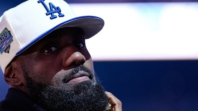 Los Angeles Lakers' Lebron James stands on the court before an NBA basketball preseason game against the Golden State Warriors, (AP) Los Angeles Lakers' Lebron James stands on the court before an NBA basketball preseason game against the Golden State Warriors, (AP)