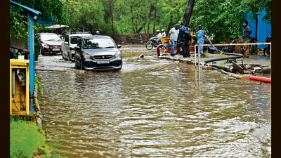 Motorists make their way through a waterlogged road in Sector 43, Chandigarh on Monday. (Ravi Kumar/HT) Motorists make their way through a waterlogged road in Sector 43, Chandigarh on Monday. (Ravi Kumar/HT)
