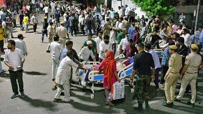 Patients, hospital staff and others gather after a fire broke out at the trauma centre of the state-run Sawai Man Singh (SMS) Hospital, late Sunday night, in Jaipur, (PTI) Patients, hospital staff and others gather after a fire broke out at the trauma centre of the state-run Sawai Man Singh (SMS) Hospital, late Sunday night, in Jaipur, (PTI)