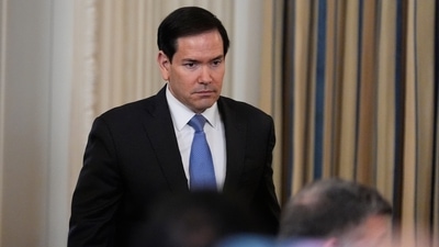 Marco Rubio arrives during a news conference in the State Dining Room of the White House. (AP) Marco Rubio arrives during a news conference in the State Dining Room of the White House. (AP)