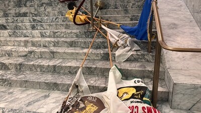In this undated photo provided by the Department of Enterprise Services, a Washington state government agency, county flags sit burned on marble steps inside the capitol (AP) In this undated photo provided by the Department of Enterprise Services, a Washington state government agency, county flags sit burned on marble steps inside the capitol (AP)